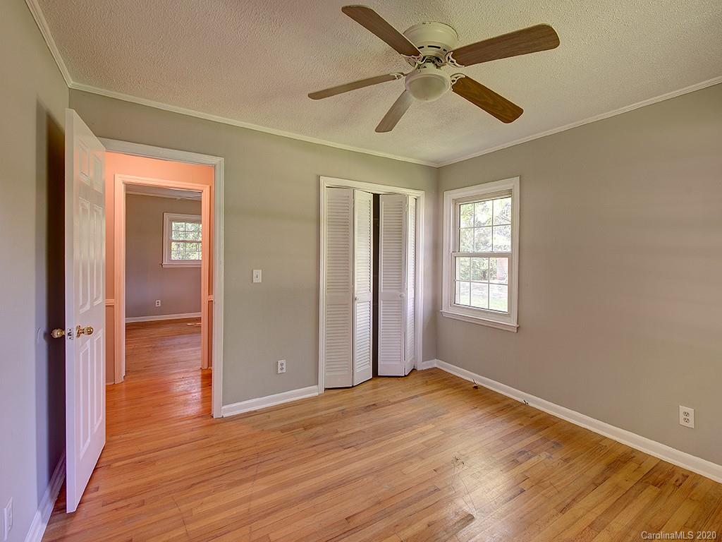 858 State Rd S-29-376 Lancaster, SC 29720 - Photo 19 of 28 wooden floor in an empty room with a window