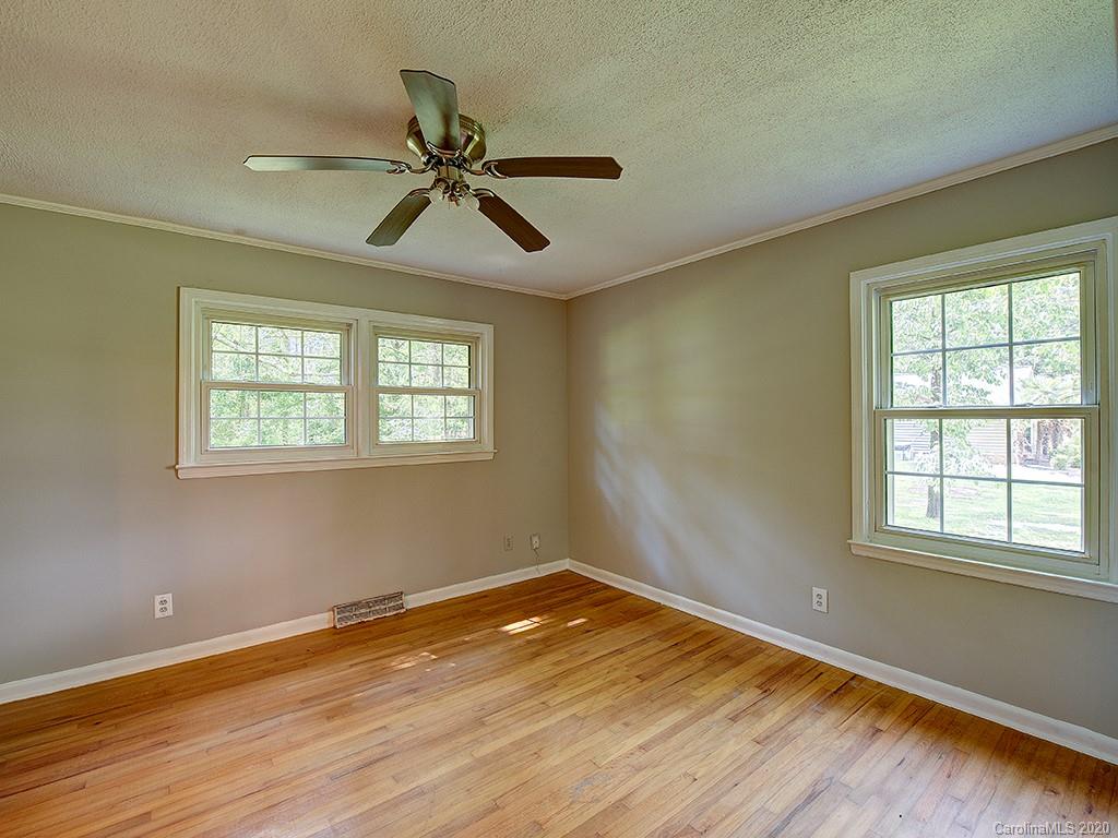 858 State Rd S-29-376 Lancaster, SC 29720 - Photo 20 of 28 a view of empty room with wooden floor and fan
