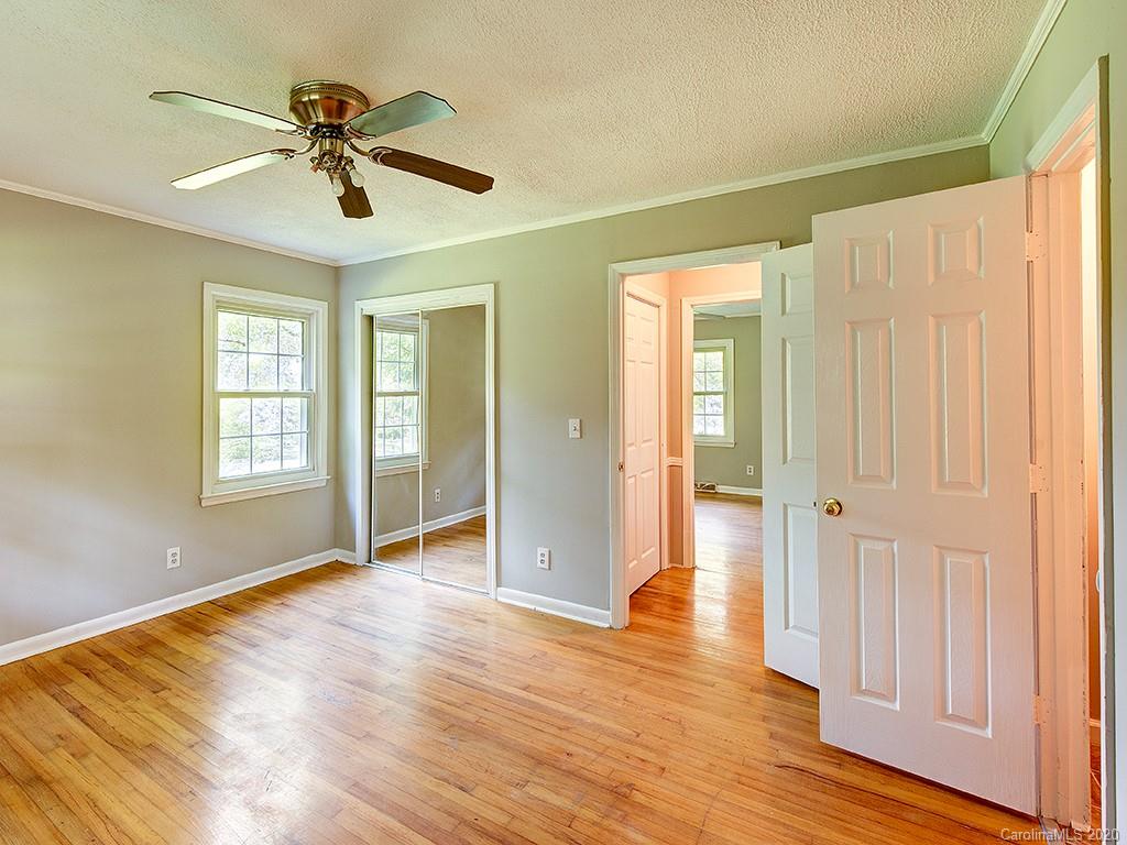 858 State Rd S-29-376 Lancaster, SC 29720 - Photo 21 of 28 a view of an empty room with wooden floor and a window