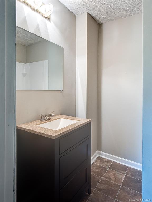 858 State Rd S-29-376 Lancaster, SC 29720 - Photo 22 of 28 a bathroom with a sink and a mirror
