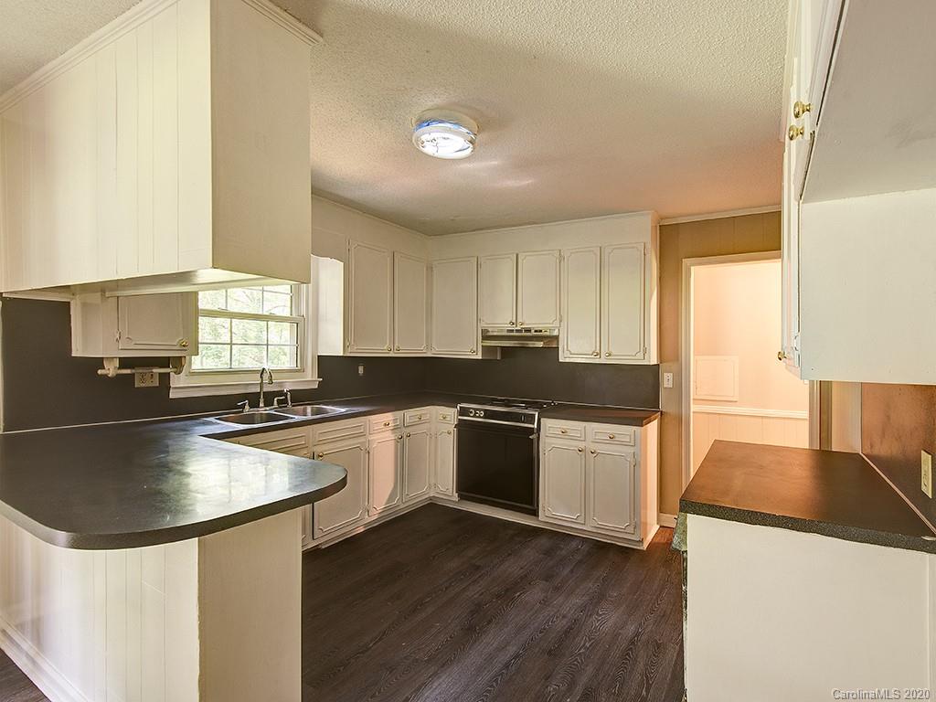 858 State Rd S-29-376 Lancaster, SC 29720 - Photo 7 of 28 a kitchen with stainless steel appliances granite countertop a sink stove and refrigerator