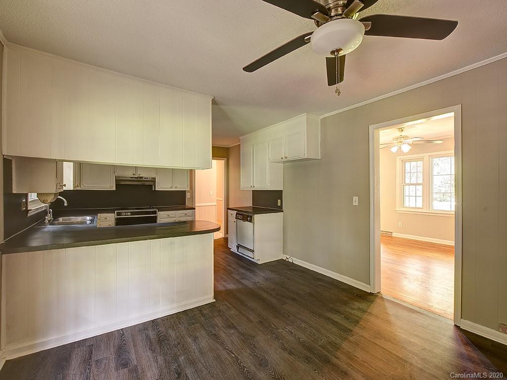858 State Rd S-29-376 Lancaster, SC 29720 - Photo 8 of 28 a kitchen with stainless steel appliances granite countertop a sink and a stove