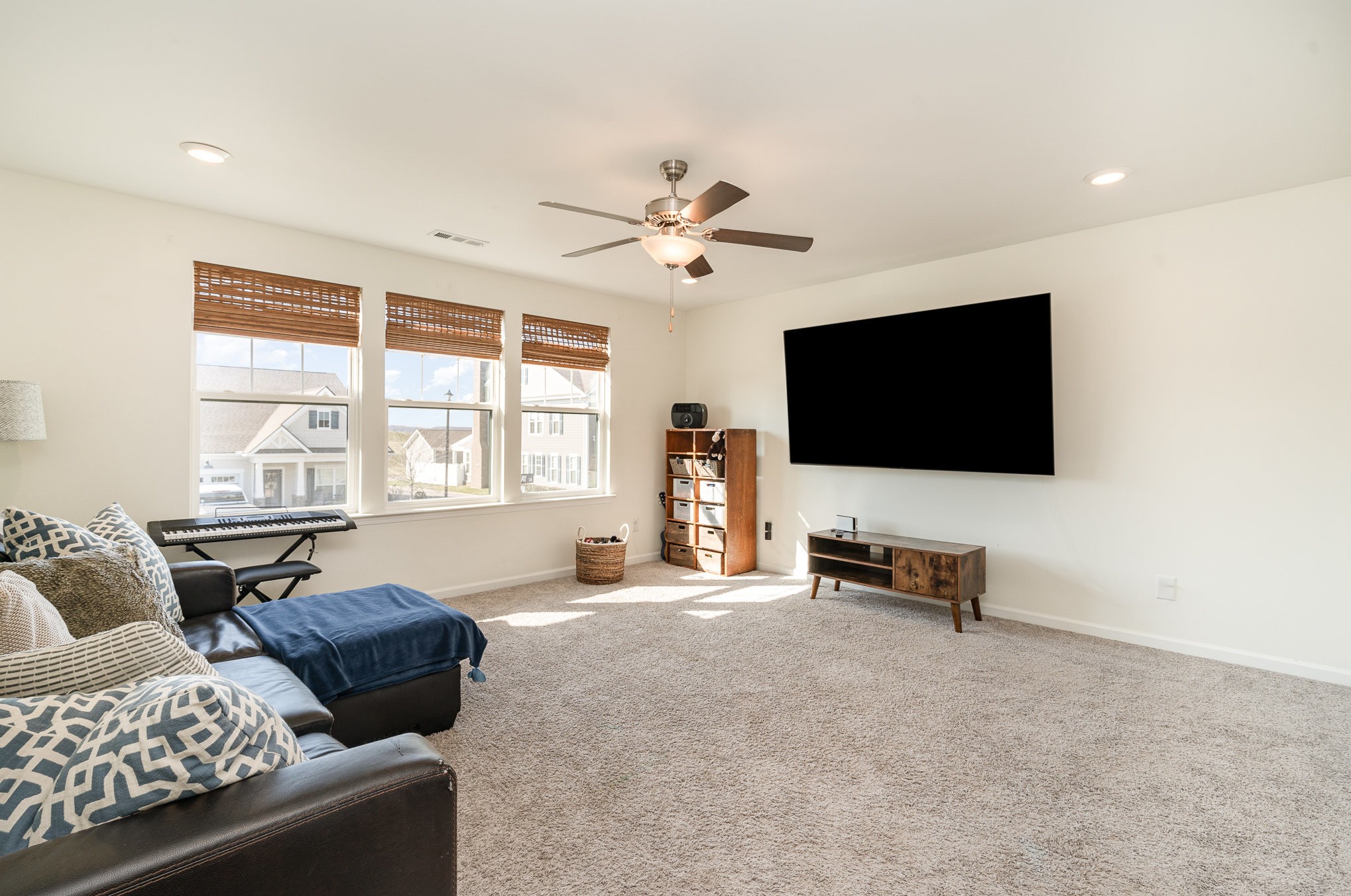 956 Carraway Lane Spring Hill, TN 37174 - Photo 12 of 27 a living room with furniture and a flat screen tv