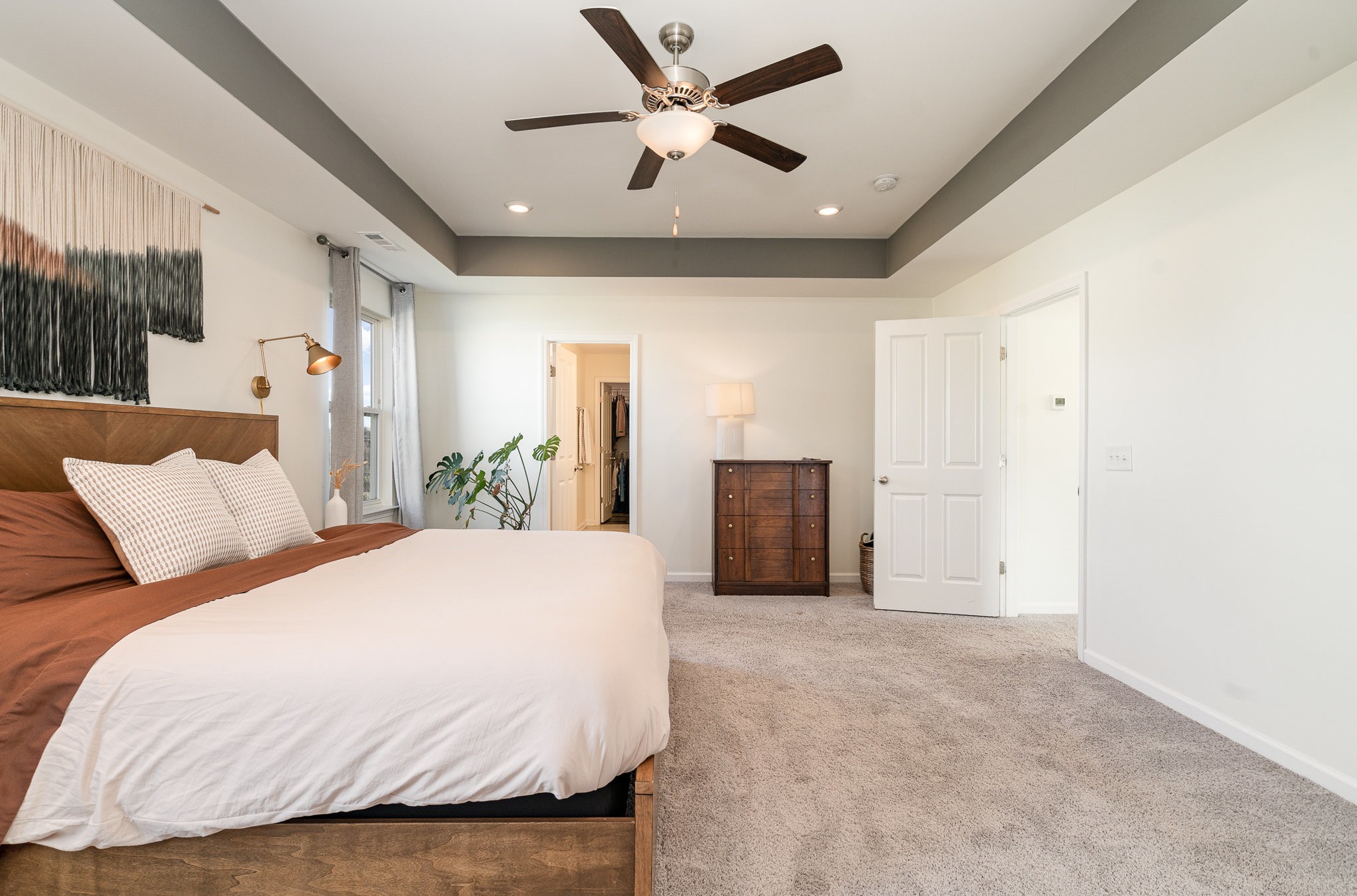 956 Carraway Lane Spring Hill, TN 37174 - Photo 14 of 27 a spacious bedroom with a bed and ceiling fan