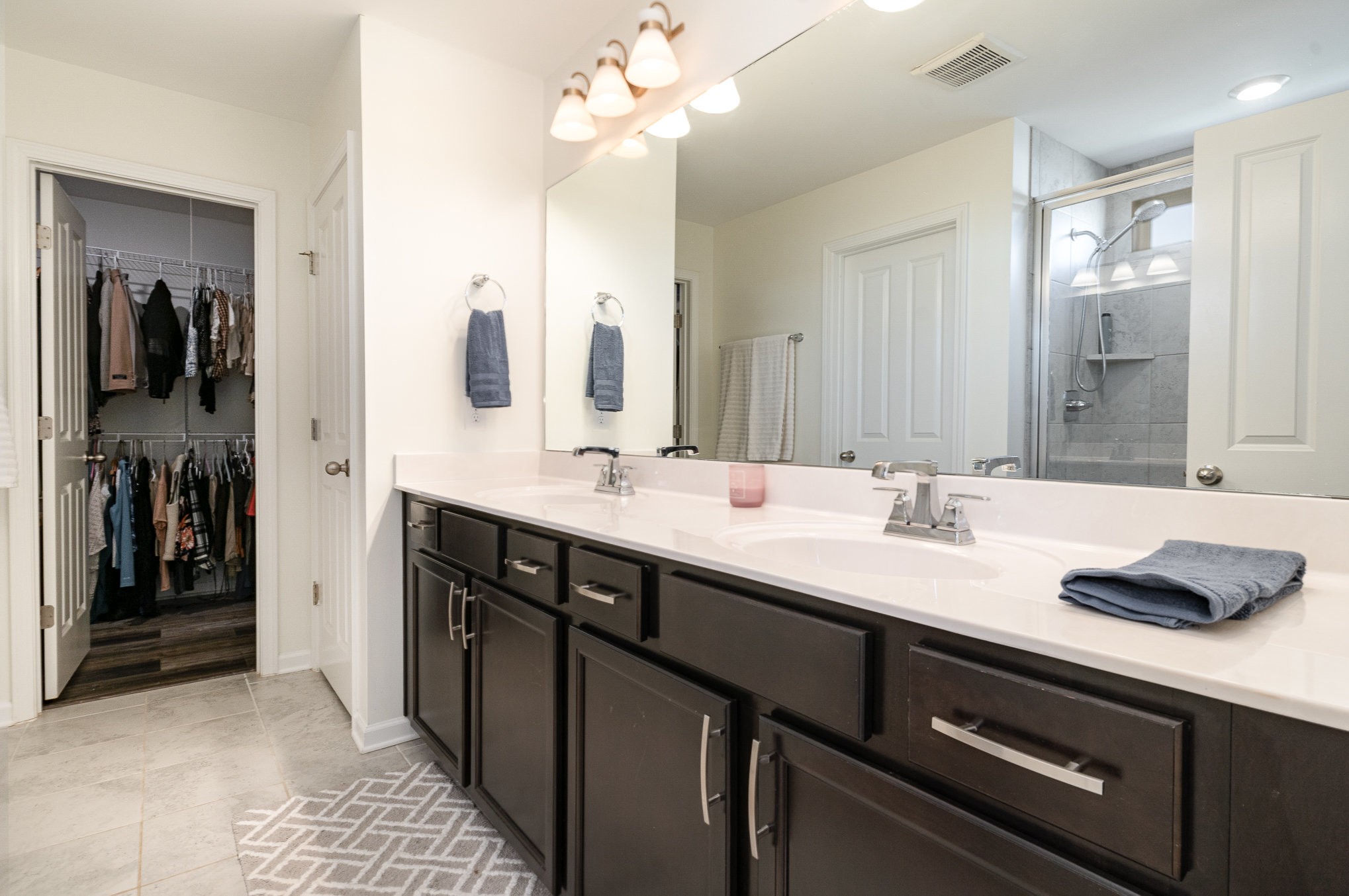 956 Carraway Lane Spring Hill, TN 37174 - Photo 15 of 27 a bathroom with a sink double vanity and a mirror