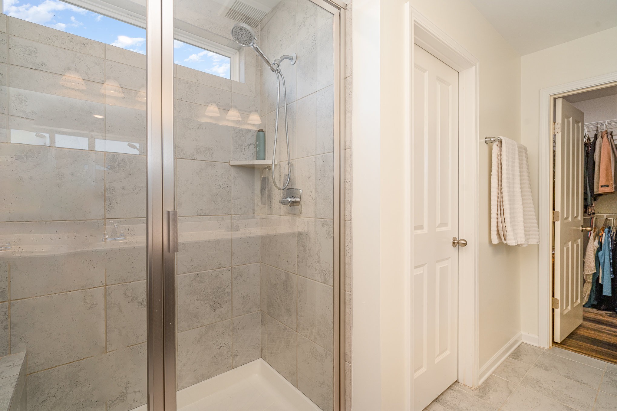 956 Carraway Lane Spring Hill, TN 37174 - Photo 16 of 27 a bathroom with a glass shower door