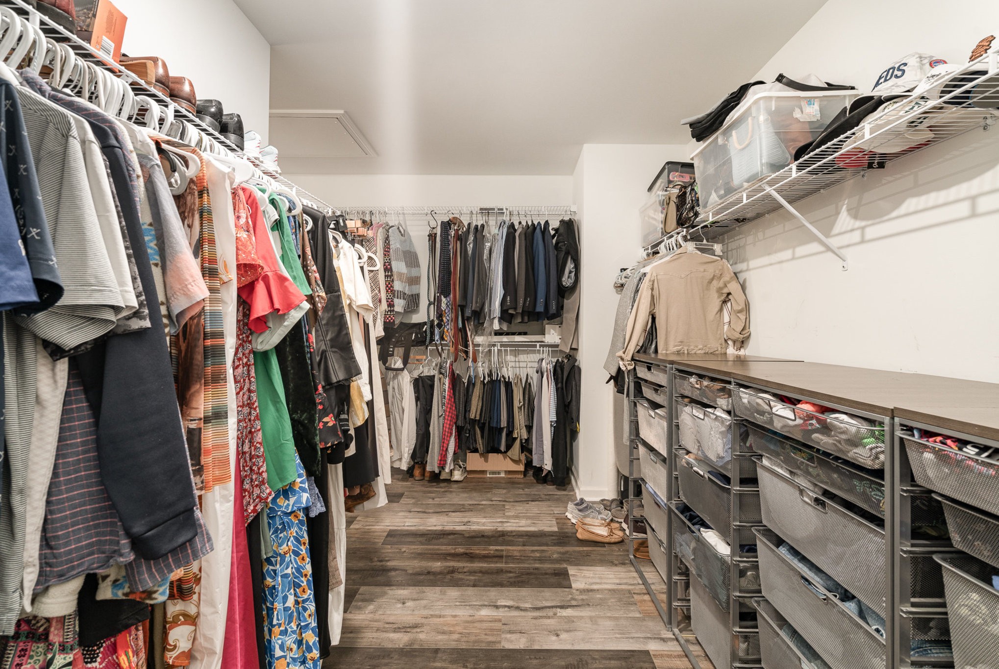 956 Carraway Lane Spring Hill, TN 37174 - Photo 17 of 27 a view of walk in closet with clothes and shoes