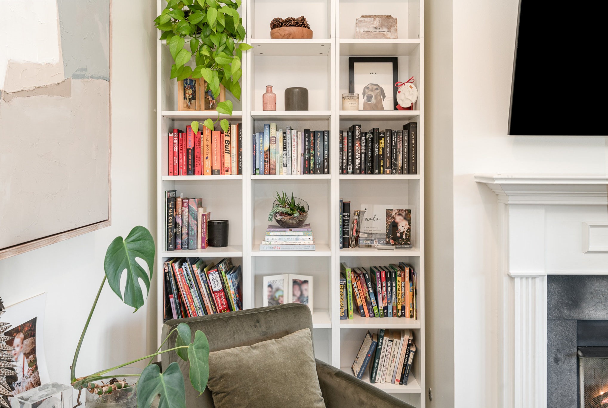 956 Carraway Lane Spring Hill, TN 37174 - Photo 7 of 27 a living room with lots of books and a book shelf