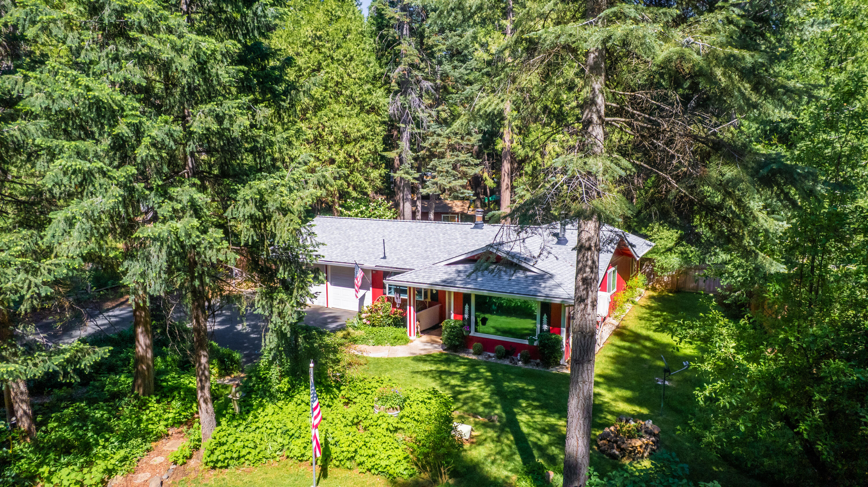 8015 Starlite Pines Road Shingletown, CA 96088 - Photo 37 of 38 aerial view of a house with a yard and large trees
