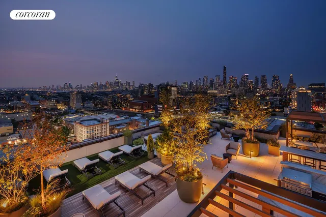 a kitchen with stainless steel appliances granite countertop a refrigerator a stove a sink a dining table and chairs with wooden floor