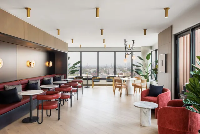 a living room with furniture a flat screen tv and a large window