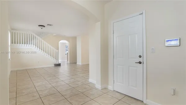 a view of an empty room and window