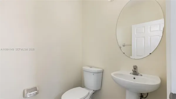 a kitchen with a refrigerator a microwave and a sink