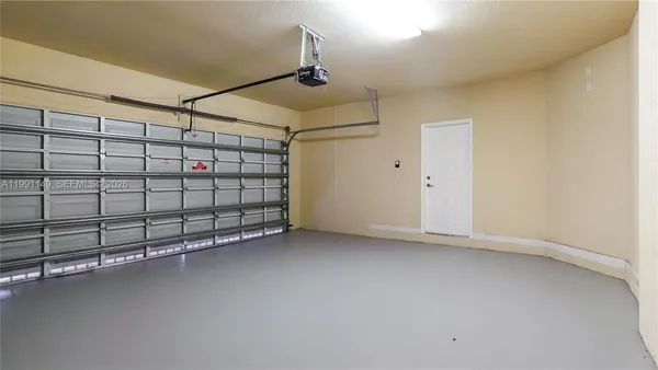 a view of a room with wooden floor and window