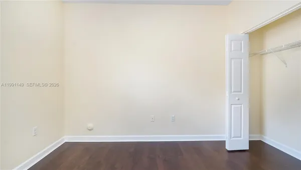 a view of a room with wooden floor and small space