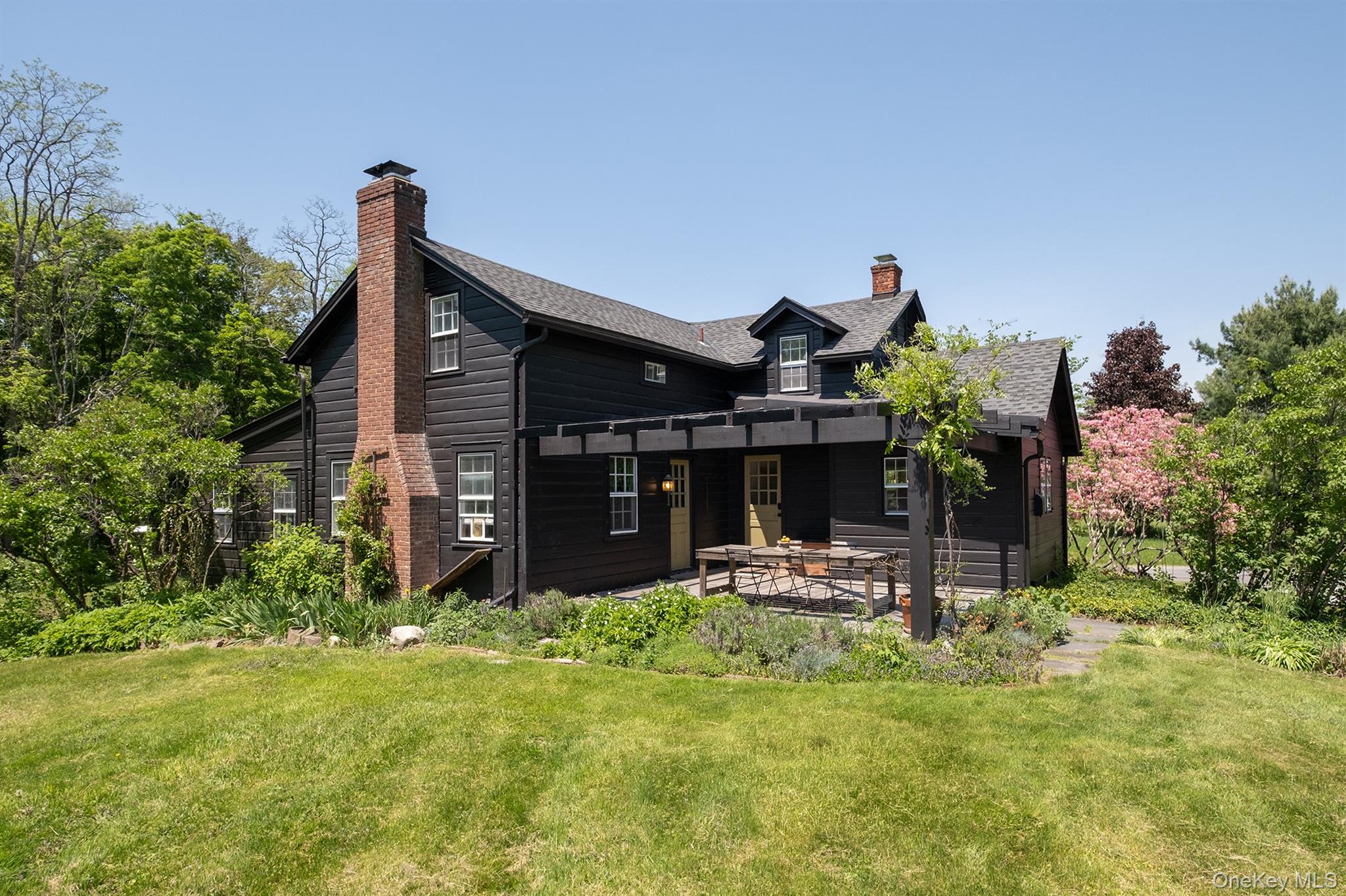77 Upper Hook Road Rhinebeck, NY 12572 - Photo 41 of 48 a view of a house with backyard and sitting area