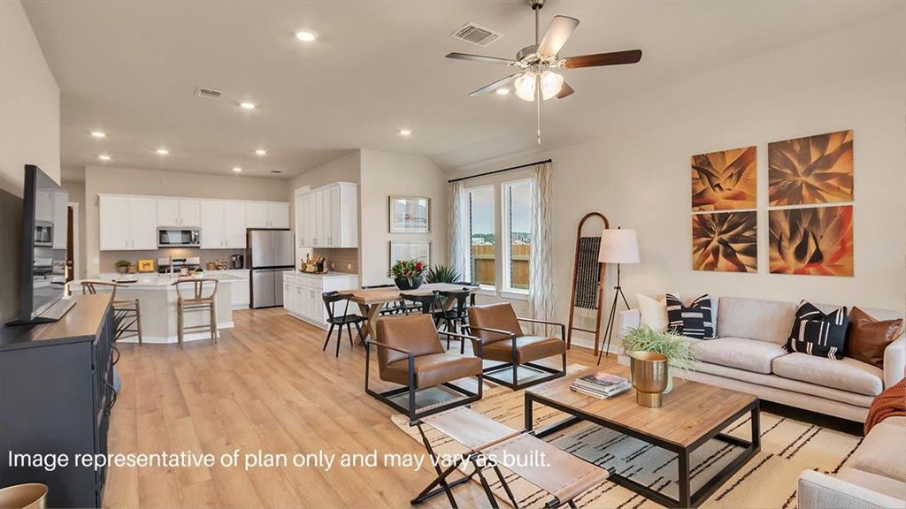 1620 Buckskin Road Oak Point, TX 75068 - Photo 13 of 26 a living room with furniture kitchen view and a large window