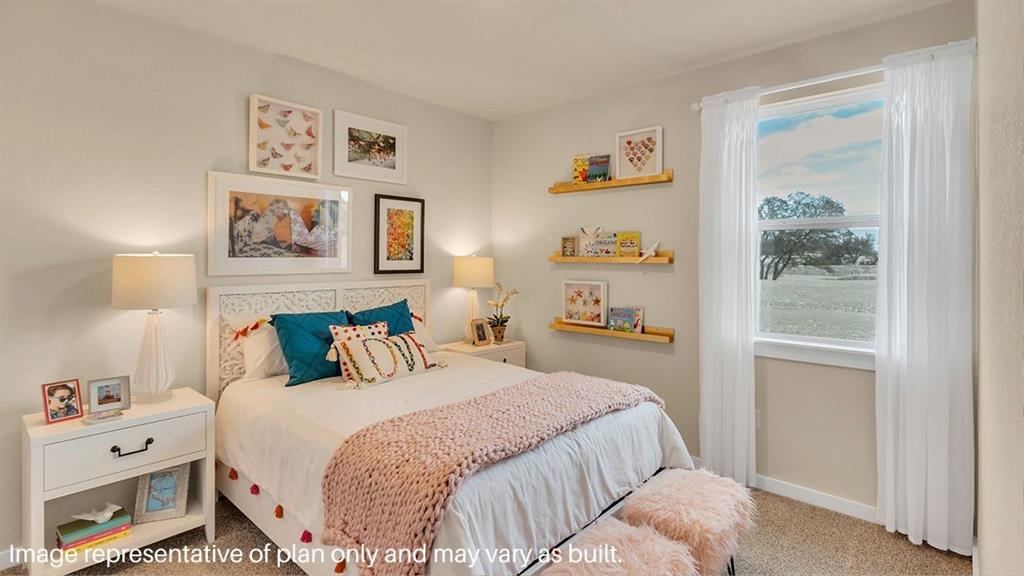 1620 Buckskin Road Oak Point, TX 75068 - Photo 23 of 26 a bedroom with a bed and a window
