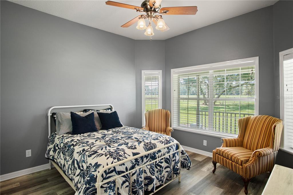 9045 Lake Hatchineha Road Kissimmee, FL 34759 - Photo 30 of 47 a bedroom with a bed and a large window