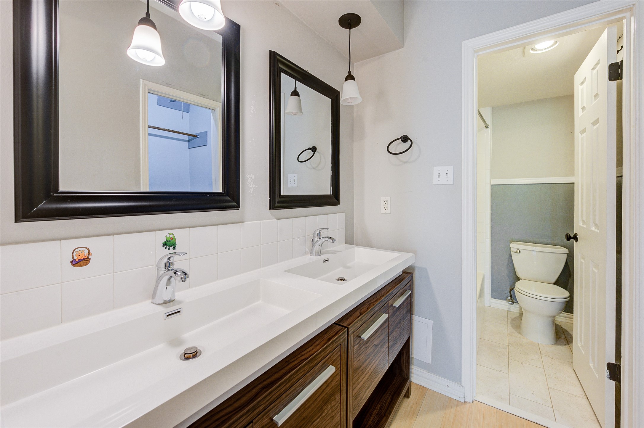 2100 Tanglewilde Street, Unit 51 Houston, TX 77063 - Photo 15 of 24 a bathroom with a sink a toilet and shower