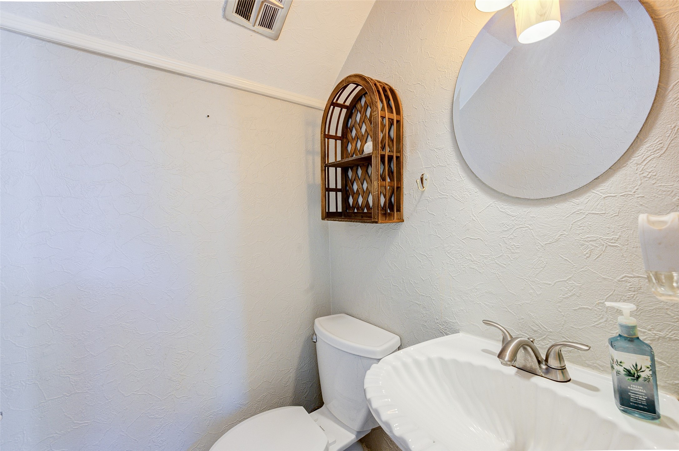 2100 Tanglewilde Street, Unit 51 Houston, TX 77063 - Photo 21 of 24 a bathroom with a toilet and a sink