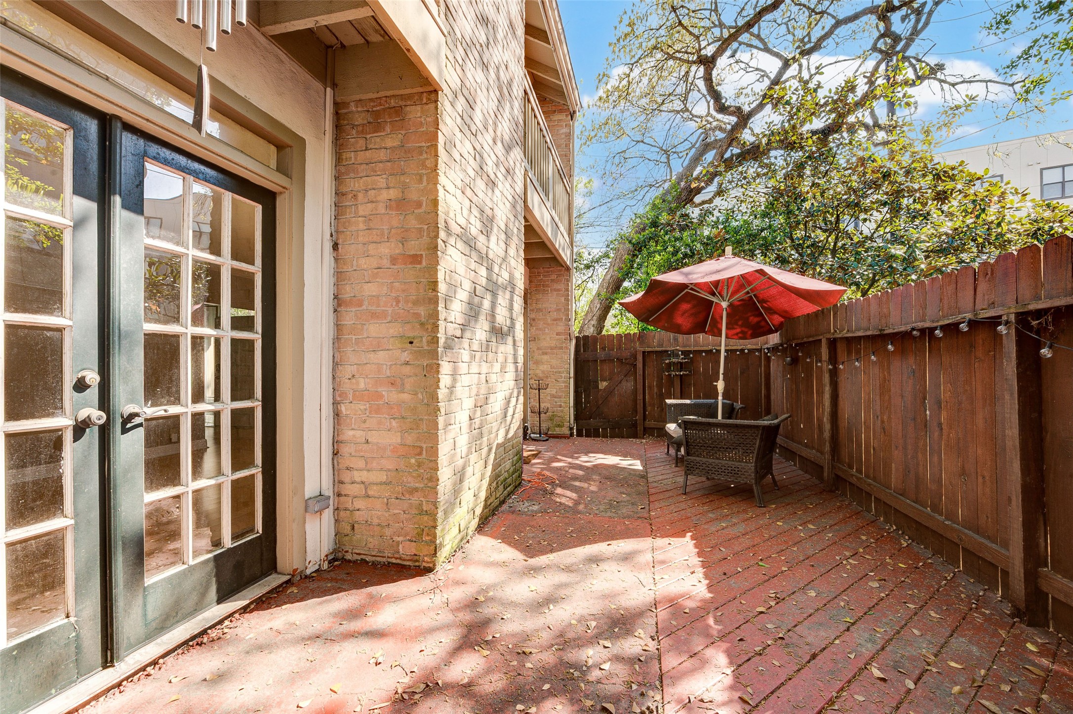 2100 Tanglewilde Street, Unit 51 Houston, TX 77063 - Photo 23 of 24 a view of a house with backyard and sitting area