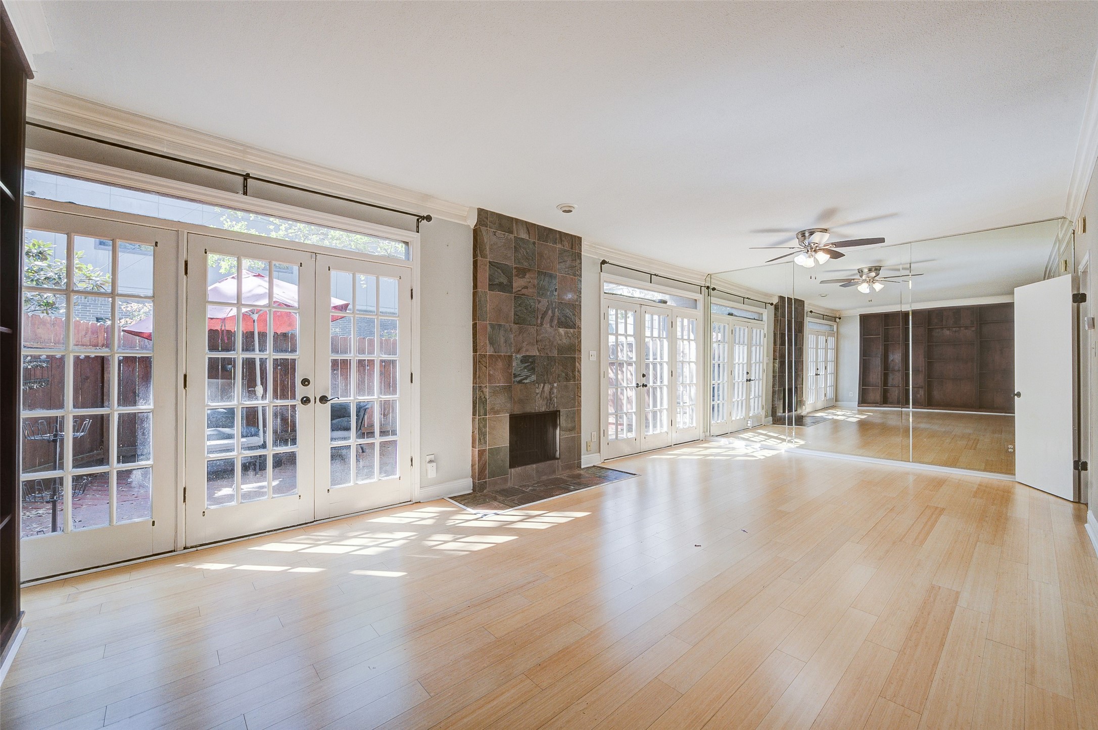 2100 Tanglewilde Street, Unit 51 Houston, TX 77063 - Photo 6 of 24 a view of an empty room with a window and fireplace