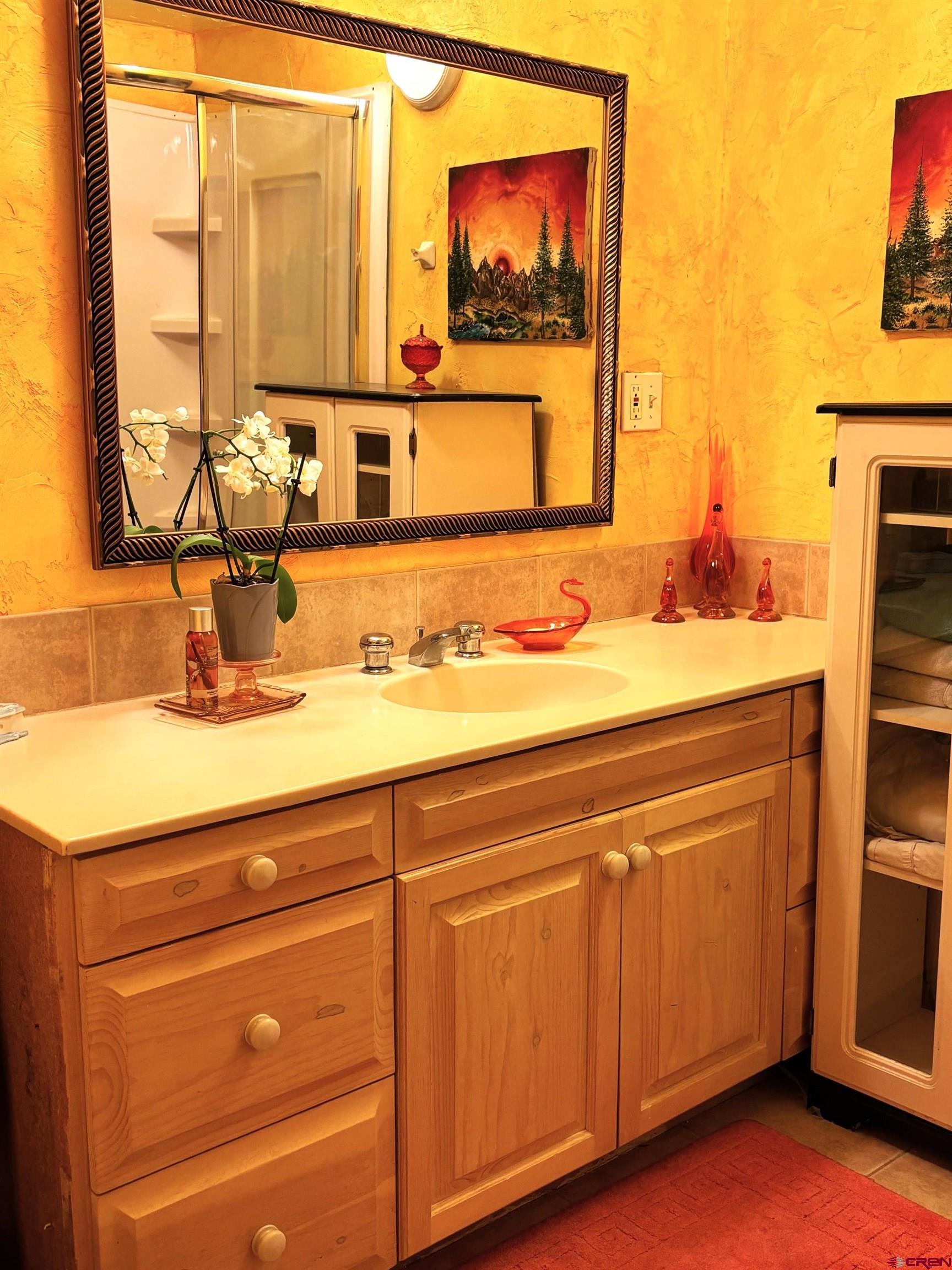 135 Aspenglow Lane Ridgway, CO 81432 - Photo 12 of 19 a bathroom with a sink and a mirror