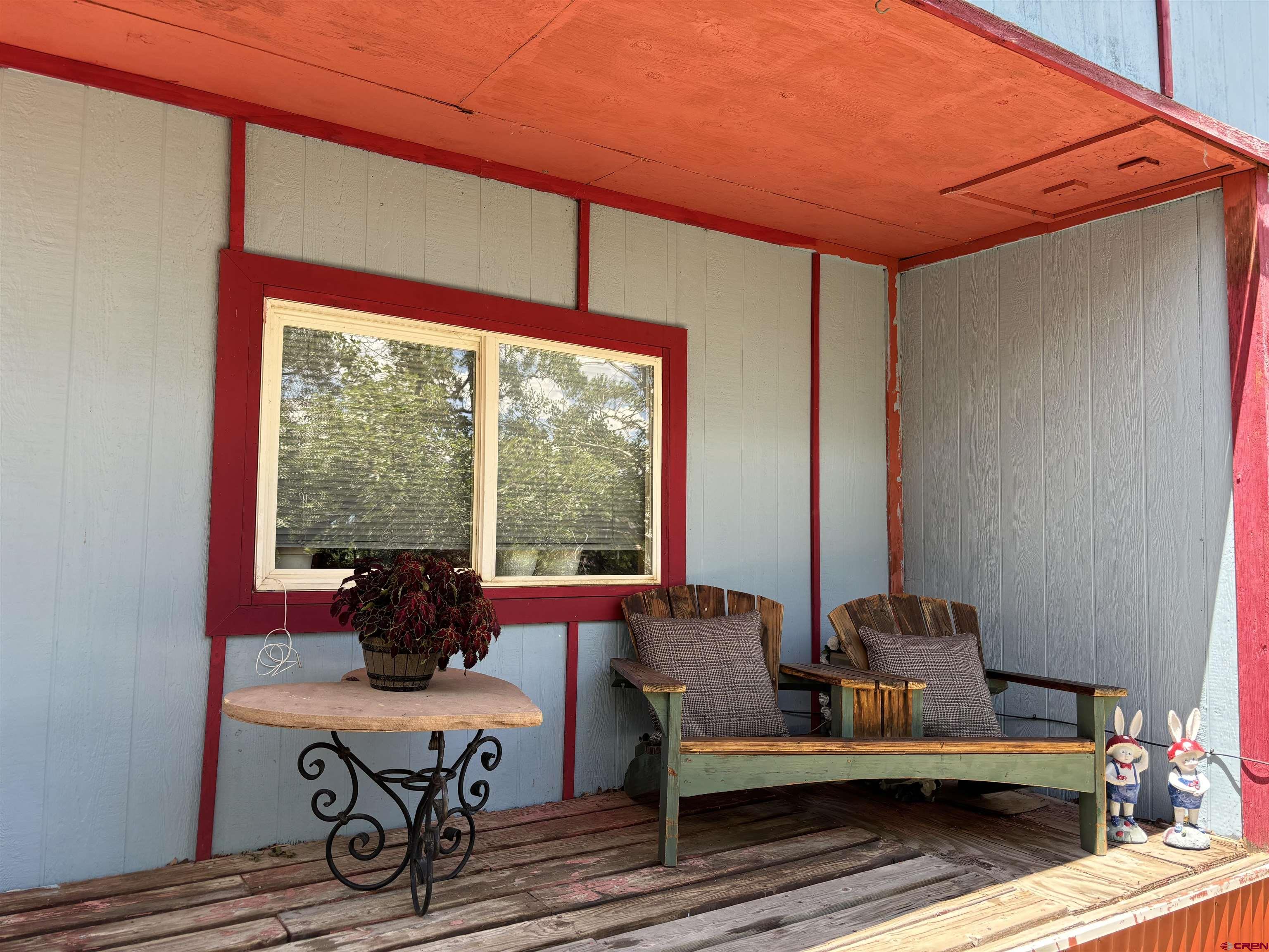 135 Aspenglow Lane Ridgway, CO 81432 - Photo 3 of 19 a living room with furniture and a window