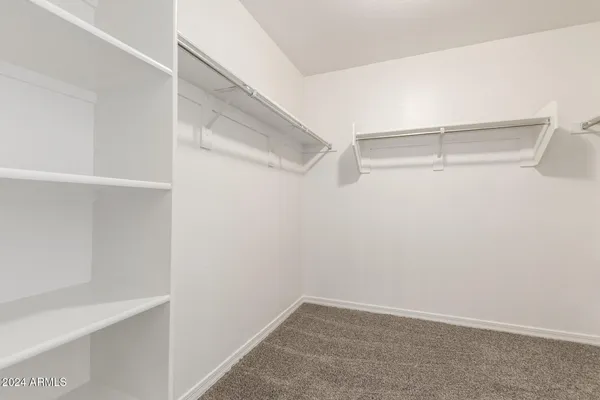 a view of an empty walk in closet