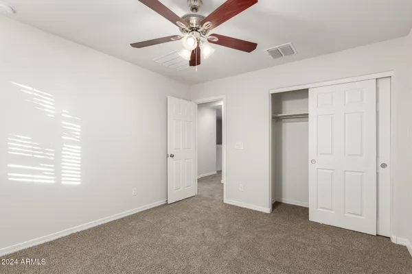 a view of an empty room and window