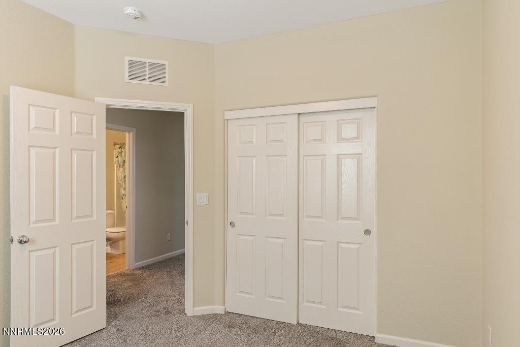 1864 Wind Ranch Road, Unit B Reno, NV 89521 - Photo 24 of 42 an empty room with windows
