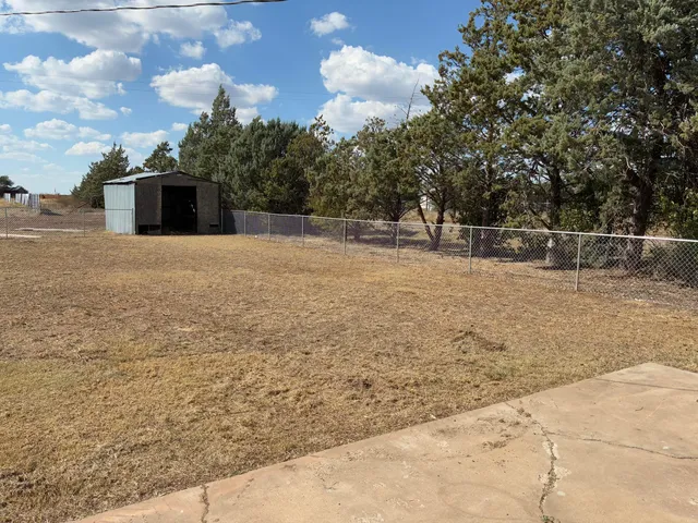 a backyard of a house with lots of green space