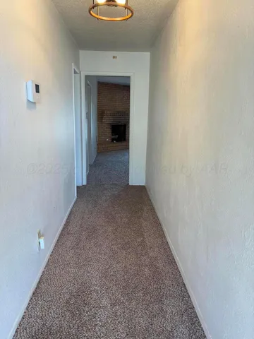 a view of a hallway to a room