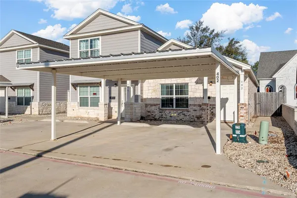 front view of a house with a patio