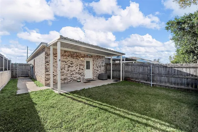 a picture of a bench in front of a wall