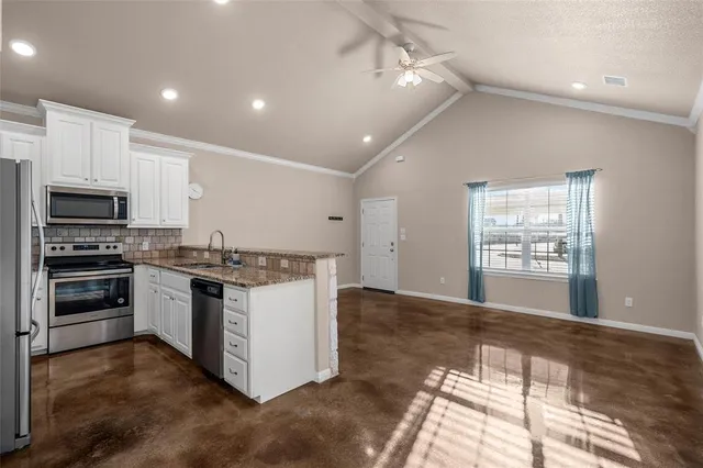 a kitchen with a stove and a microwave