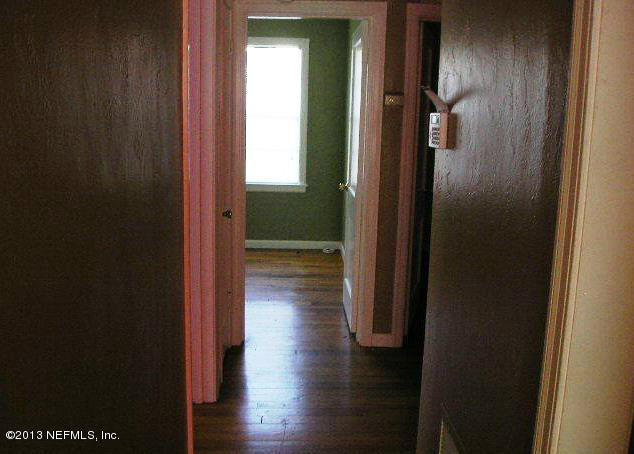 5039 Sunderland Road Jacksonville, FL 32210 - Photo 19 of 20 a view of a hallway with wooden floor