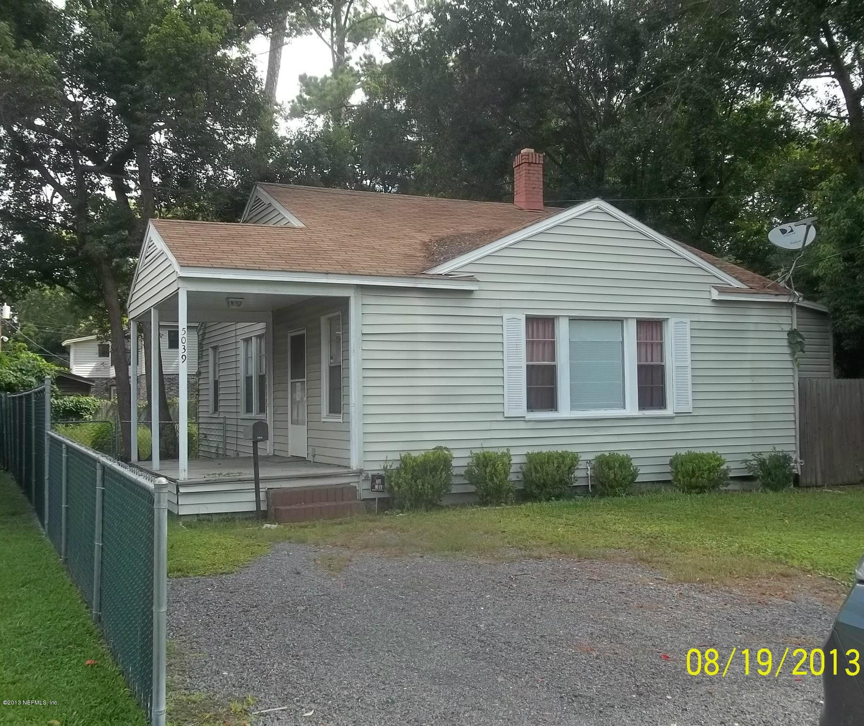 5039 Sunderland Road Jacksonville, FL 32210 - Photo 20 of 20 a front view of a house with a yard