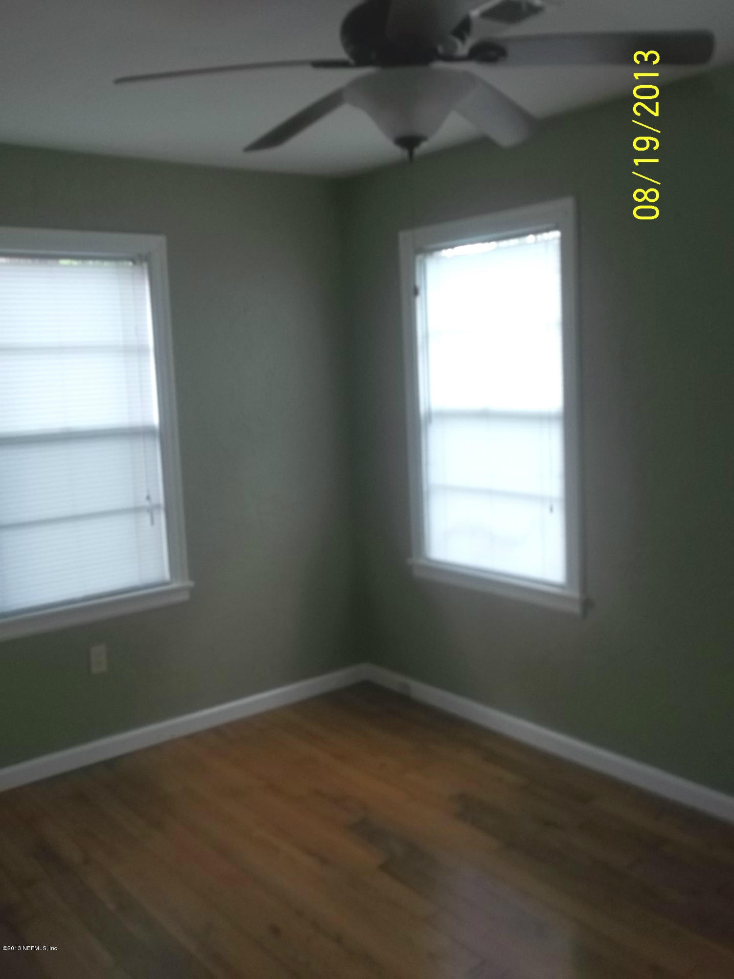 5039 Sunderland Road Jacksonville, FL 32210 - Photo 3 of 20 an empty room with a window