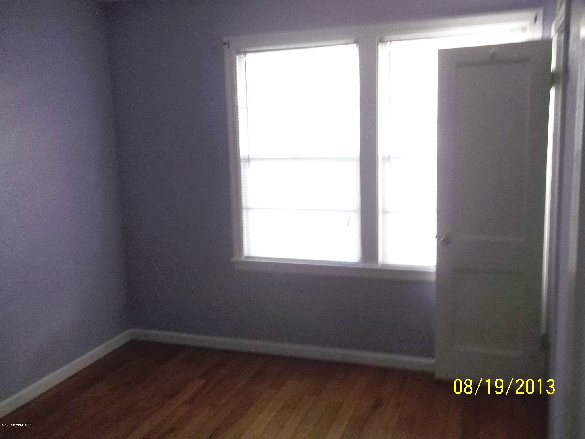 5039 Sunderland Road Jacksonville, FL 32210 - Photo 4 of 20 an empty room with a window