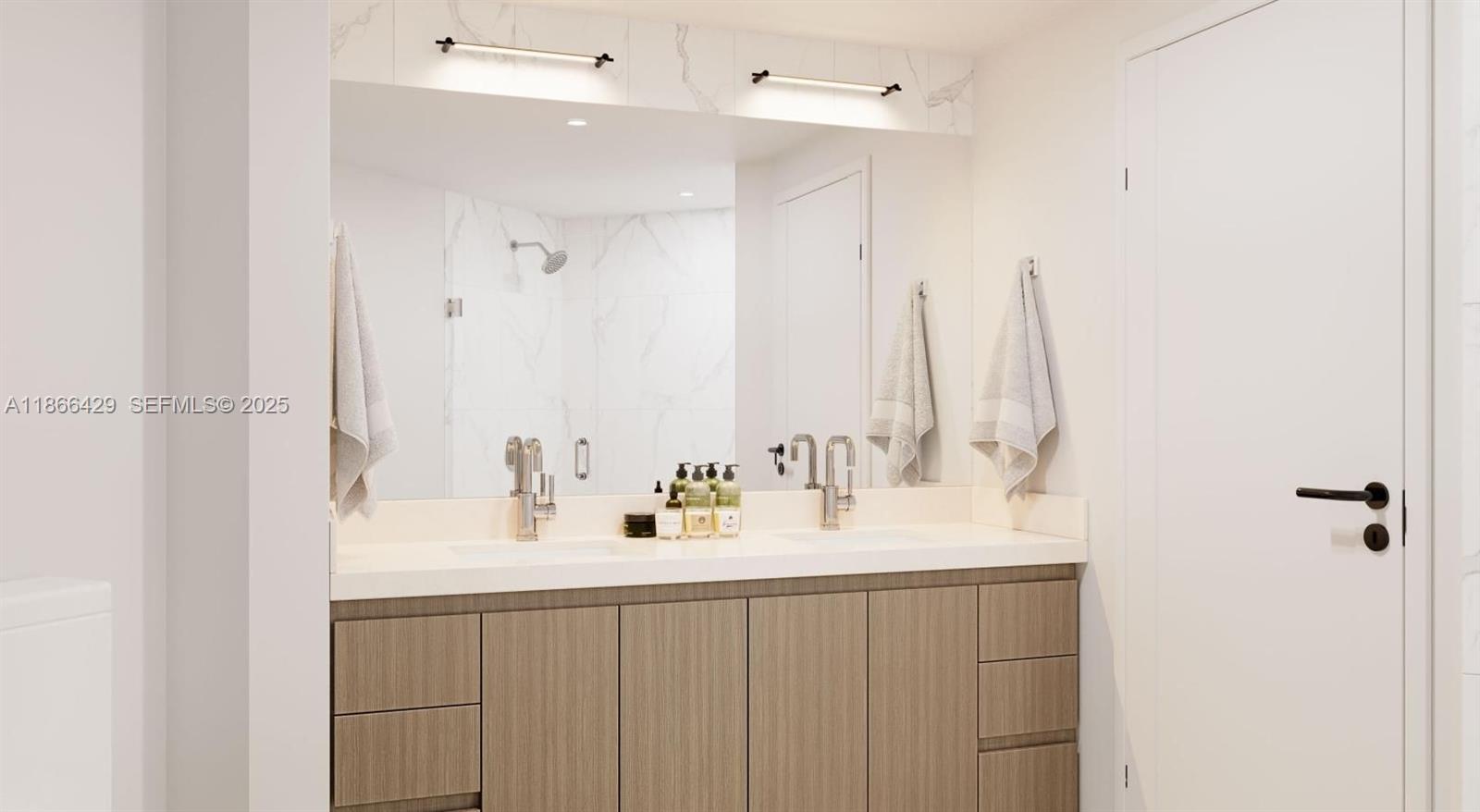 4465 Griffin Road, Unit A1B Davie, FL 33314 - Photo 12 of 13 a bathroom with a sink and a mirror