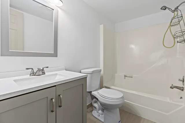 a bathroom with a sink a toilet and a bathtub