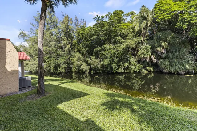 a view of a lake with a building in the background