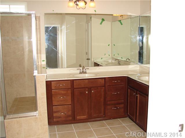 4113 Perth Road, Unit 375 Indian Land, SC 29707 - Photo 7 of 9 a bathroom with a sink and a mirror