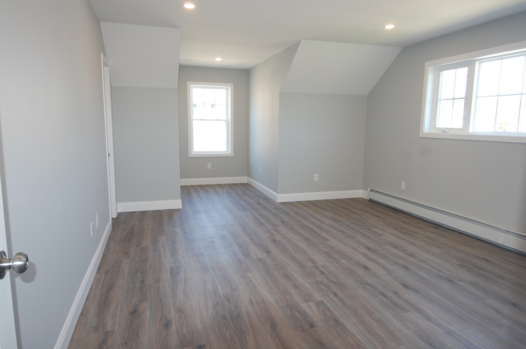 9 Bolton Road, Unit N Dartmouth, MA 02748 - Photo 12 of 19 an empty room with wooden floor and windows
