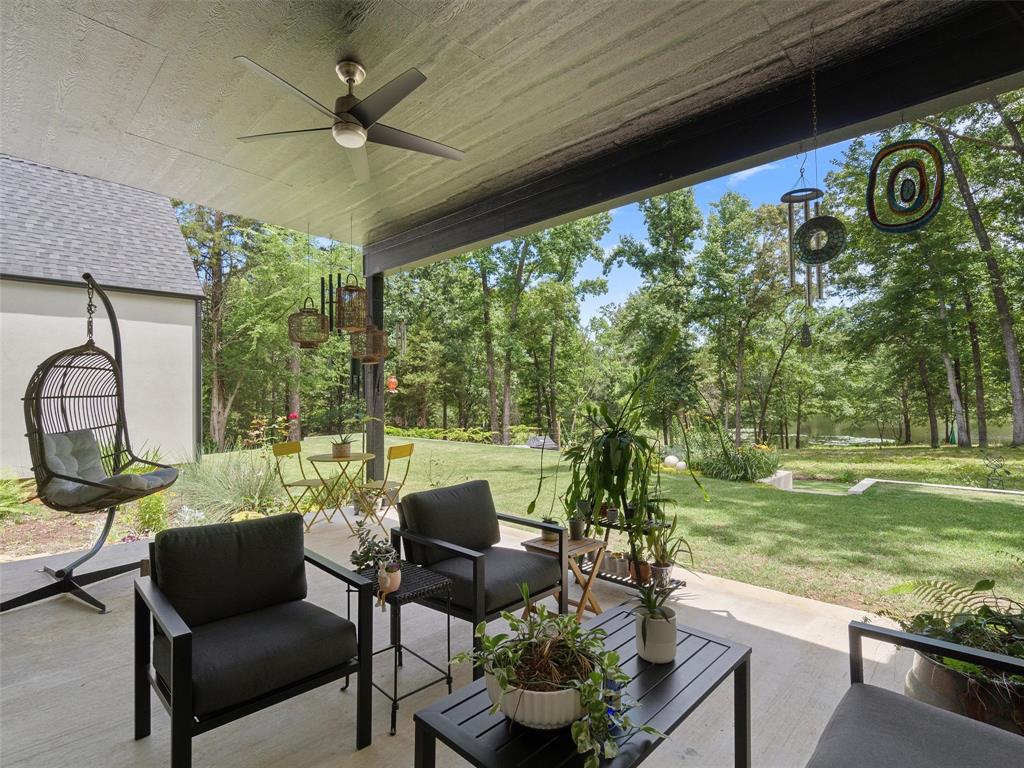 800 John Dean Road Gilmer, TX 75644 - Photo 40 of 40 a view of a porch with furniture and a yard