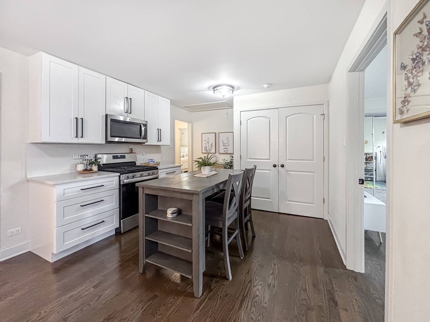 8538 45th Street Lyons, IL 60534 - Photo 15 of 29 a kitchen with a refrigerator and a stove top oven