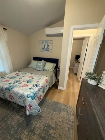 a view of a bedroom with a bed