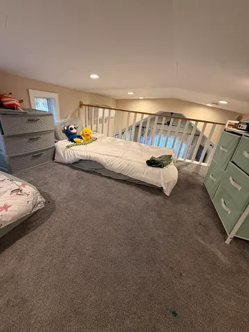 a view of balcony with furniture